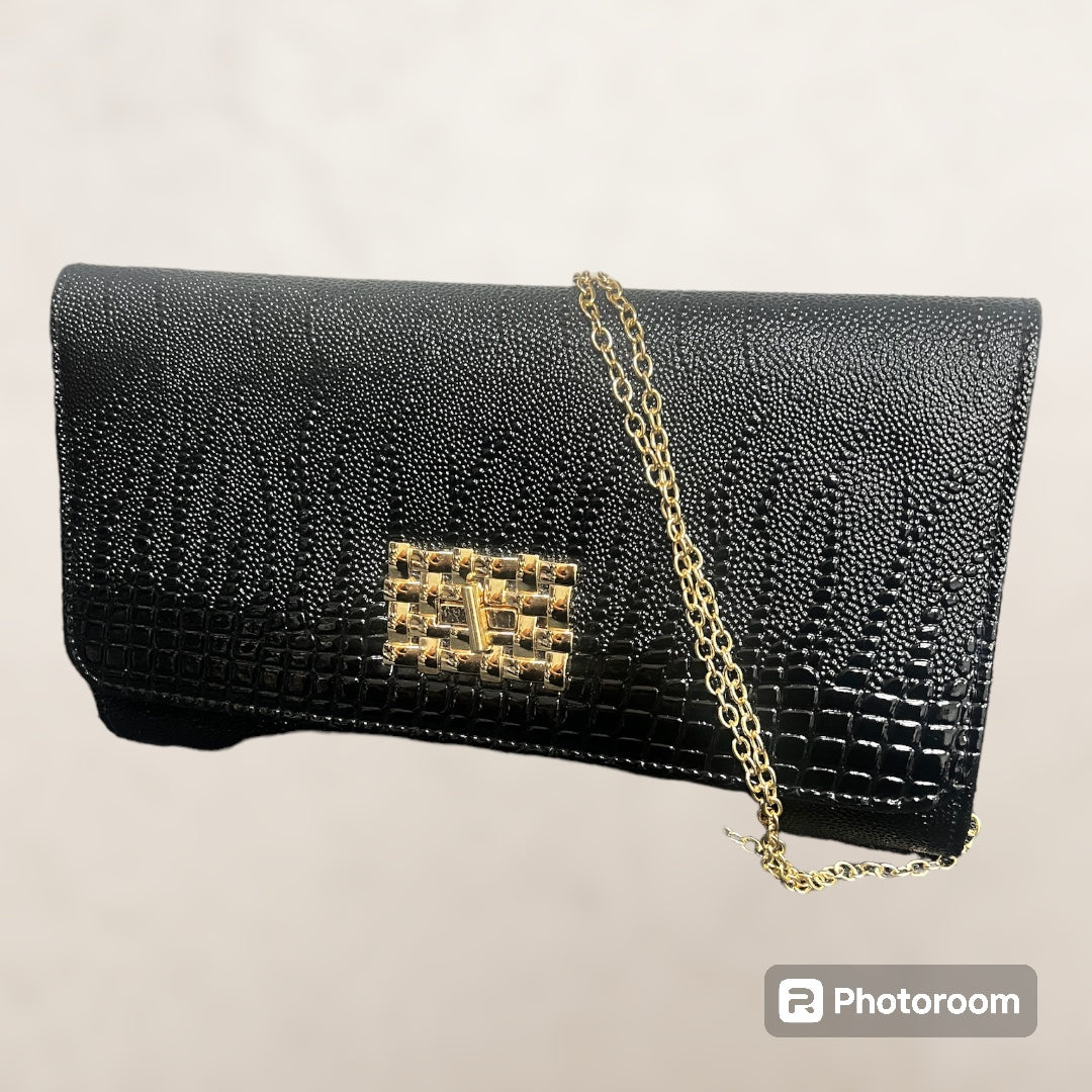 Black clutch bag gold detail